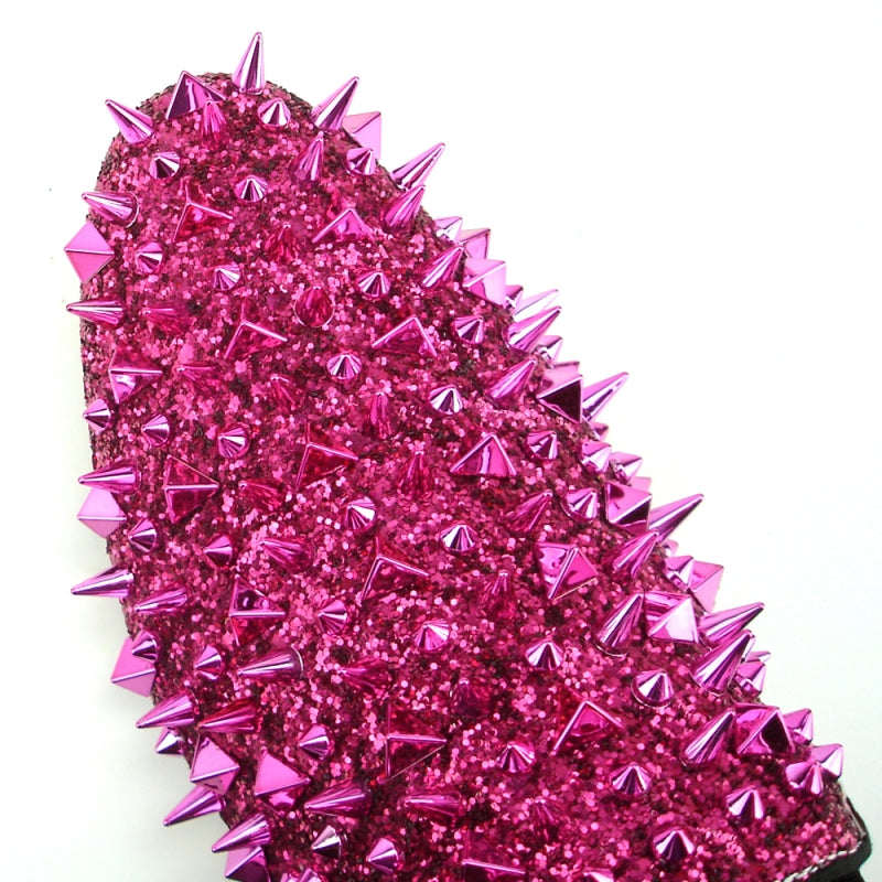 This pink slip-on, the FI-7239 Rose Glitter Rose Spikes by Fiesso, features a suede upper accented with dazzling shiny spikes and a glittery finish.