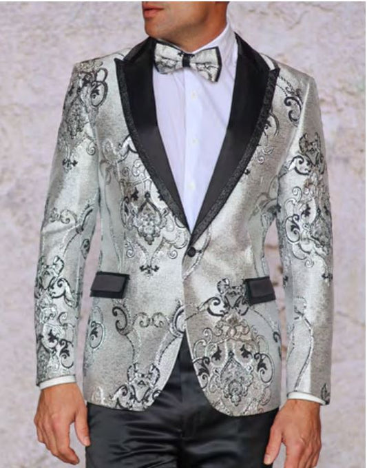 A person dressed in the Inserch INSOMNIA MZS-538 BLACK Blazer, featuring a silver embellishment and intricate patterns, paired with a white shirt and a black bow tie.