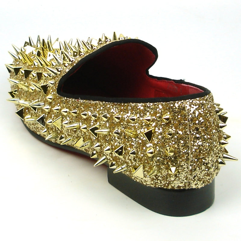 The FI-7239 Gold Glitter Gold Spikes by Fiesso showcases a suede upper embellished with dazzling gold glitter and an array of metallic spikes, combining edgy and glamorous elements for those who want to make a bold statement.