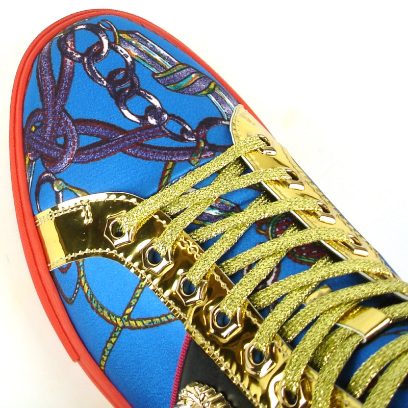 The FI-2385 Blue High Top Sneaker Encore by Fiesso showcases a vibrant blue patterned upper made from micro leather and a striking red sole. The gold accents and decorative emblem on the side enhance its stunning appeal.