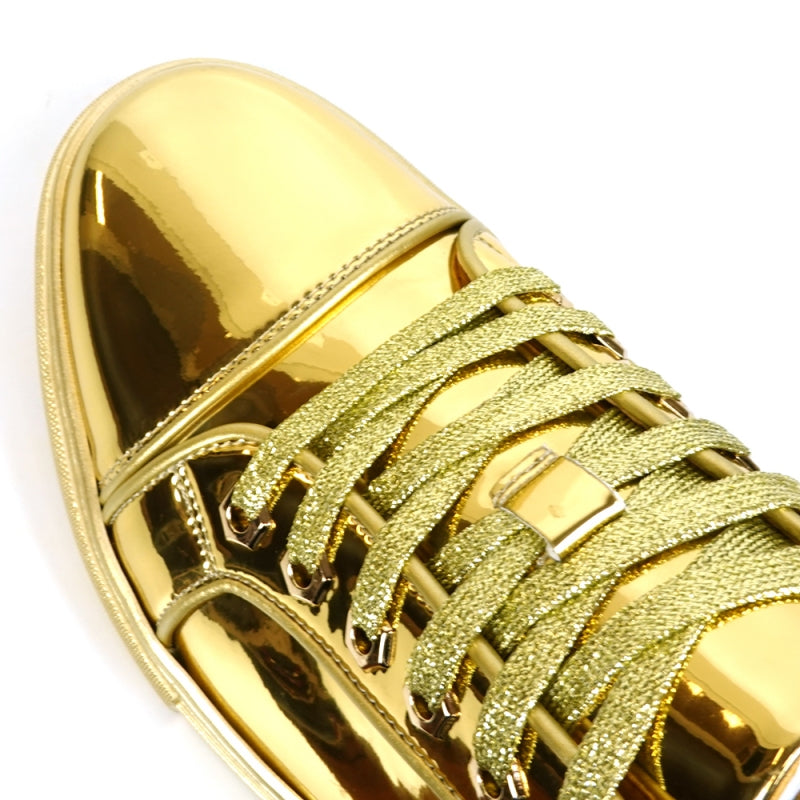 The FI-2415-2 Gold Patent Lace up Low Cut Leather Sneaker by Fiesso, viewed from above, showcases matching gold laces and a cushioned insole designed for maximum comfort.