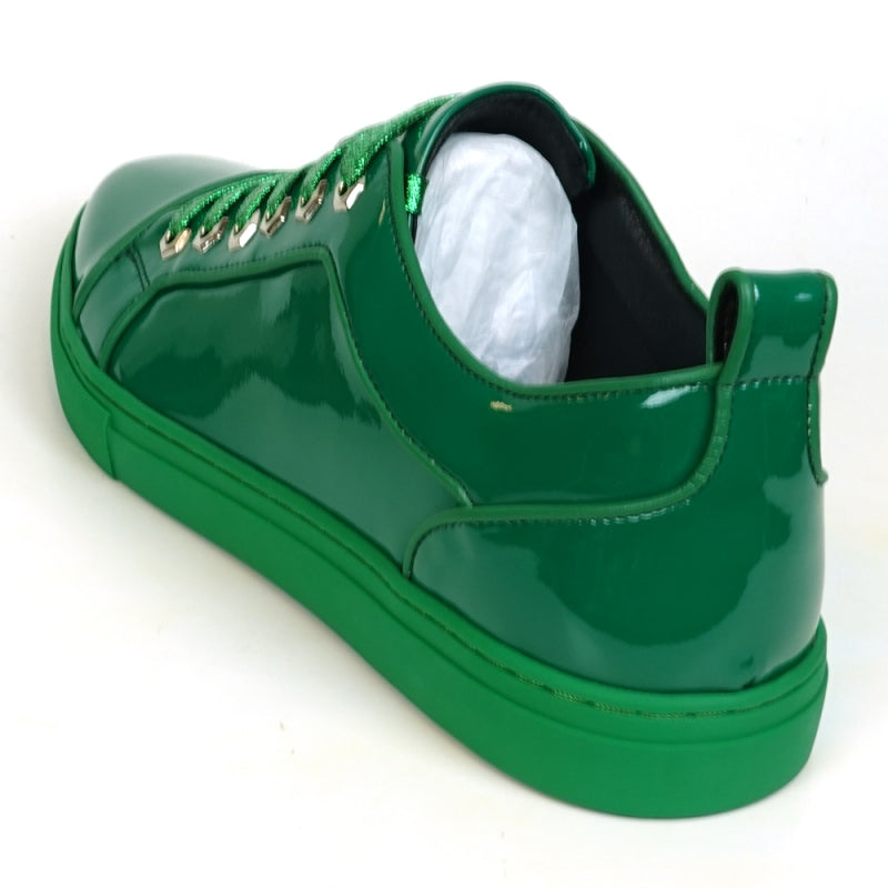 The FI-2415-2 Forest Green Patent Lace up Low Cut Leather Sneaker from Fiesso features a leather upper, shiny green laces, and metallic eyelets. Shown from an angled top view, this stylish sneaker offers both comfort and flair for casual wear.