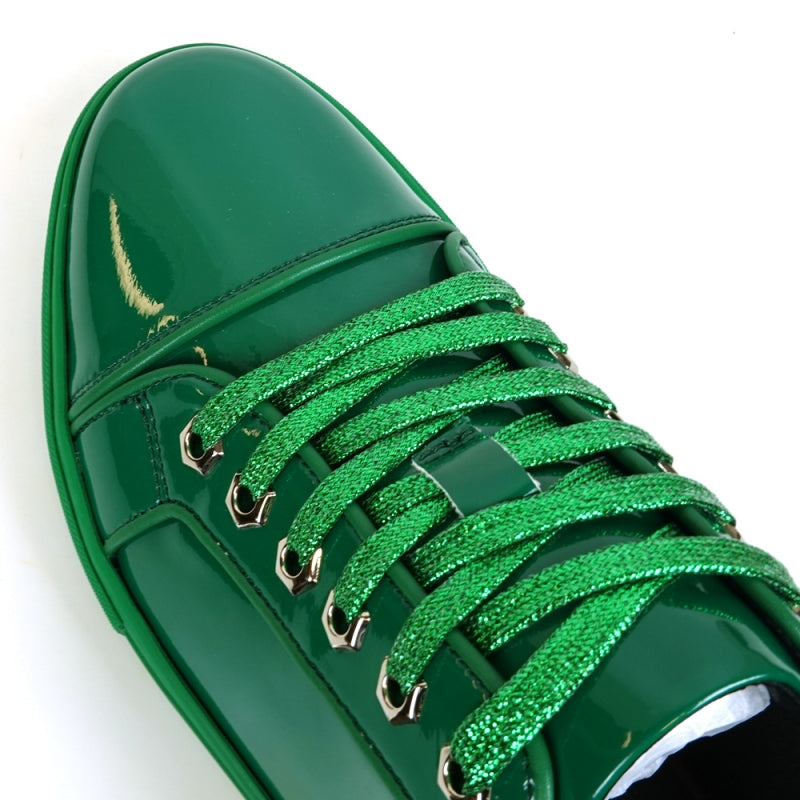 The FI-2415-2 Forest Green Patent Lace up Low Cut Leather Sneaker from Fiesso features a leather upper, shiny green laces, and metallic eyelets. Shown from an angled top view, this stylish sneaker offers both comfort and flair for casual wear.