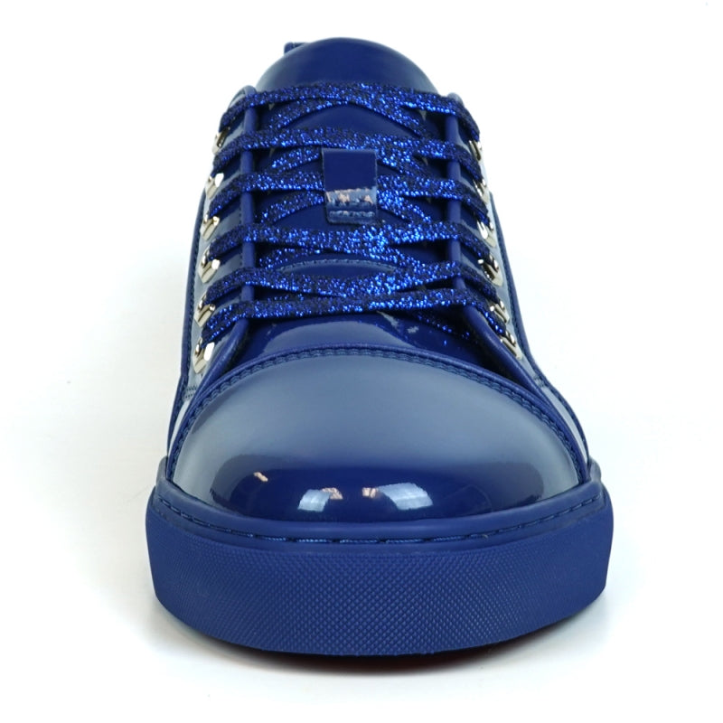 The image highlights the sole of the FI-2415-2 Navy Patent Lace-up Low Cut Leather Sneaker by Fiesso, displaying a red, textured pattern enhanced by a sleek blue trim. Renowned for their comfort and style, these sneakers also exude elegance with patent leather accents.