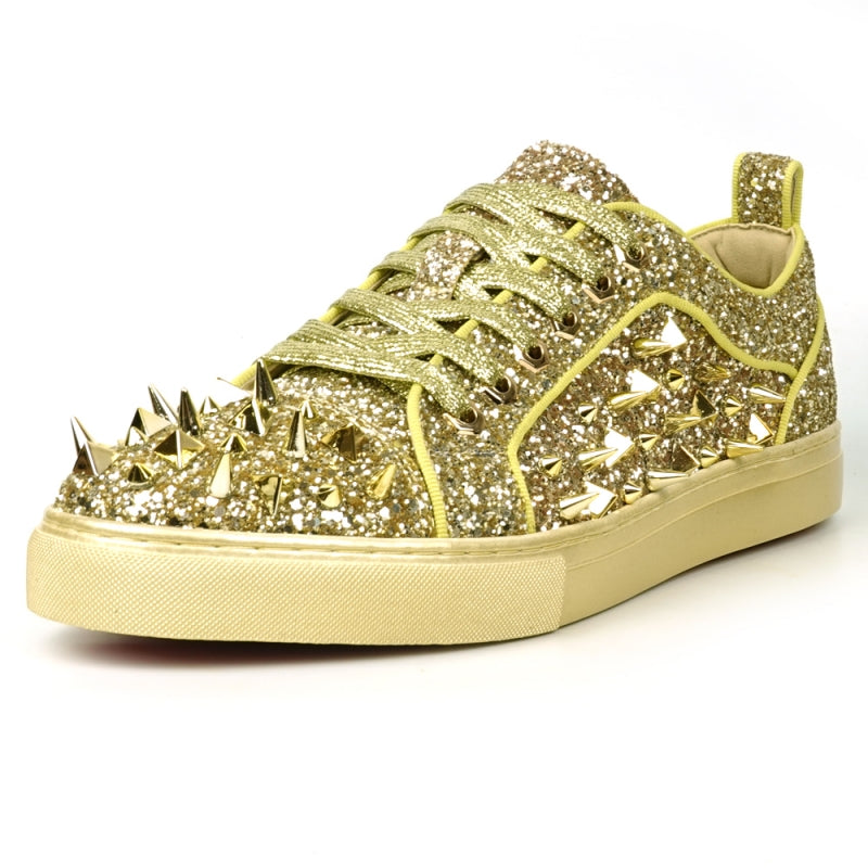 Introducing the FI-2429 Gold Glitter Gold Spikes Low Cut Sneaker Encore by Fiesso: This dazzling sneaker from Fiesso boasts a leather upper adorned with metallic spikes and studs on the toe and sides, complemented by a cushioned insole for ultimate comfort.