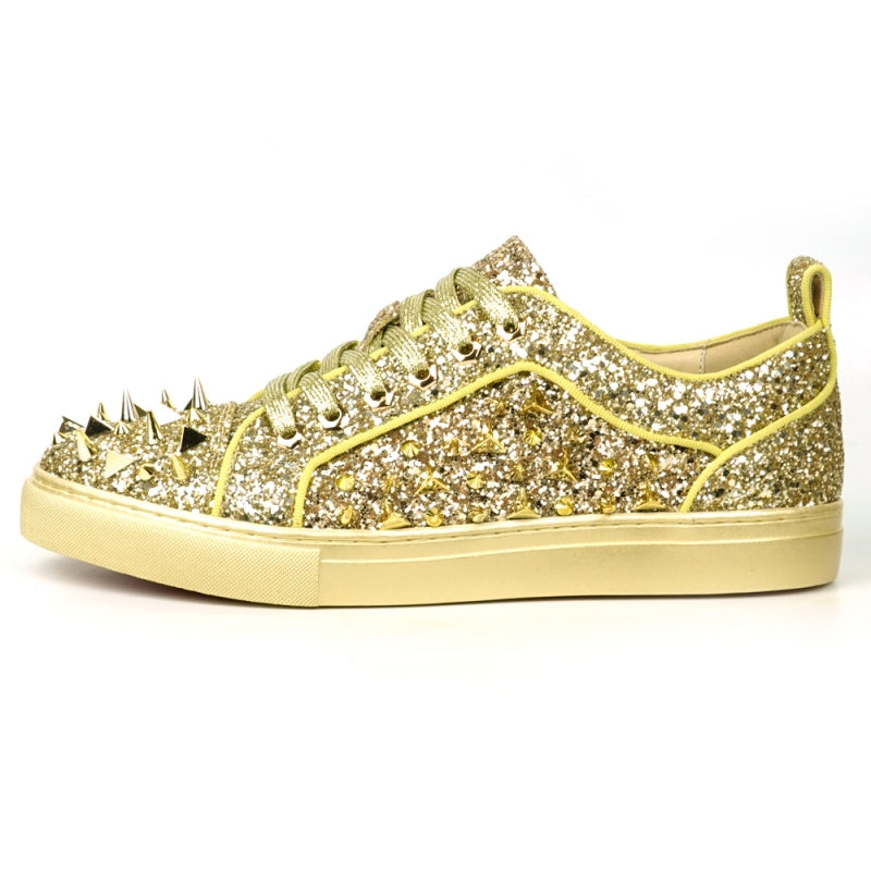 Introducing the FI-2429 Gold Glitter Gold Spikes Low Cut Sneaker Encore by Fiesso: This dazzling sneaker from Fiesso boasts a leather upper adorned with metallic spikes and studs on the toe and sides, complemented by a cushioned insole for ultimate comfort.