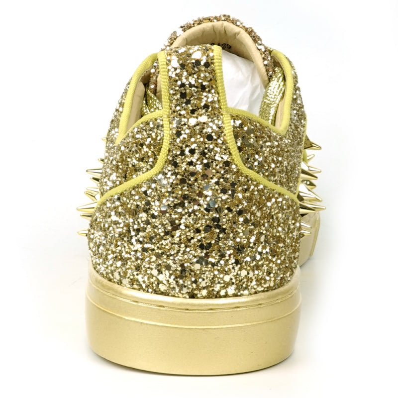 Introducing the FI-2429 Gold Glitter Gold Spikes Low Cut Sneaker Encore by Fiesso: This dazzling sneaker from Fiesso boasts a leather upper adorned with metallic spikes and studs on the toe and sides, complemented by a cushioned insole for ultimate comfort.