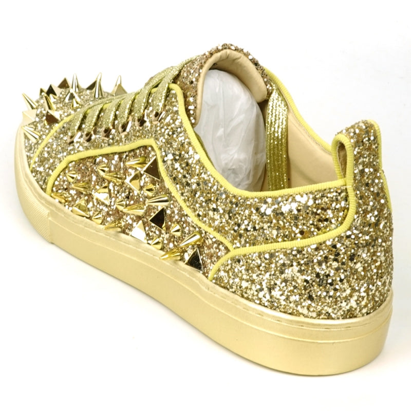 Introducing the FI-2429 Gold Glitter Gold Spikes Low Cut Sneaker Encore by Fiesso: This dazzling sneaker from Fiesso boasts a leather upper adorned with metallic spikes and studs on the toe and sides, complemented by a cushioned insole for ultimate comfort.