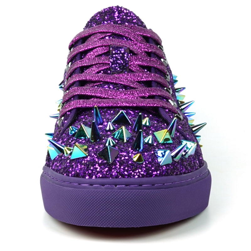 Close-up of the Encore by Fiesso, FI-2429 low-cut sneaker, showcasing a high-fashion design with purple glitter and spikes, complemented by multicolored triangular metal accents and purple laces.