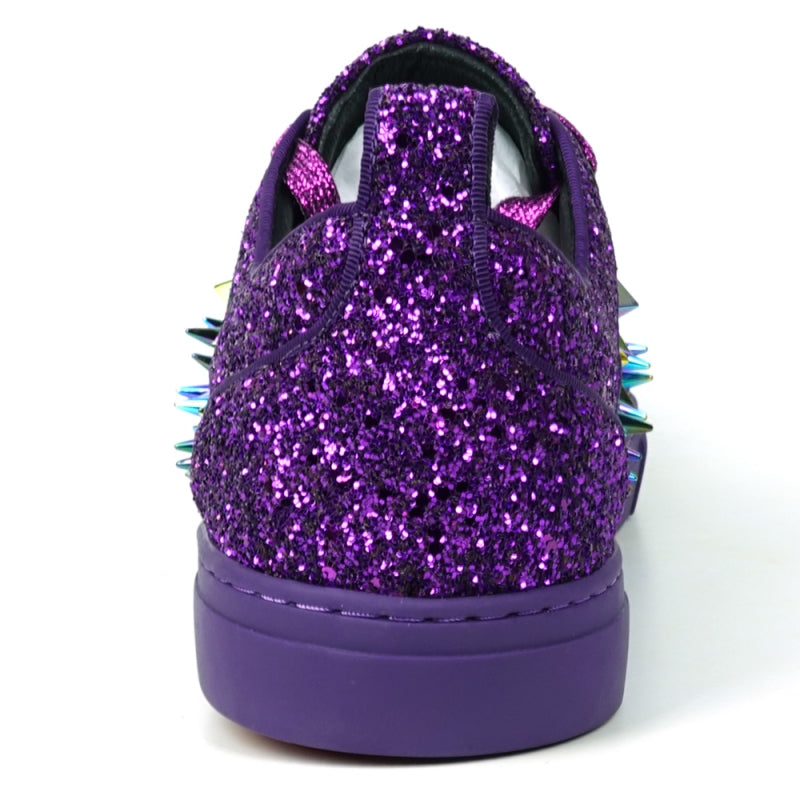 Close-up of the Encore by Fiesso, FI-2429 low-cut sneaker, showcasing a high-fashion design with purple glitter and spikes, complemented by multicolored triangular metal accents and purple laces.