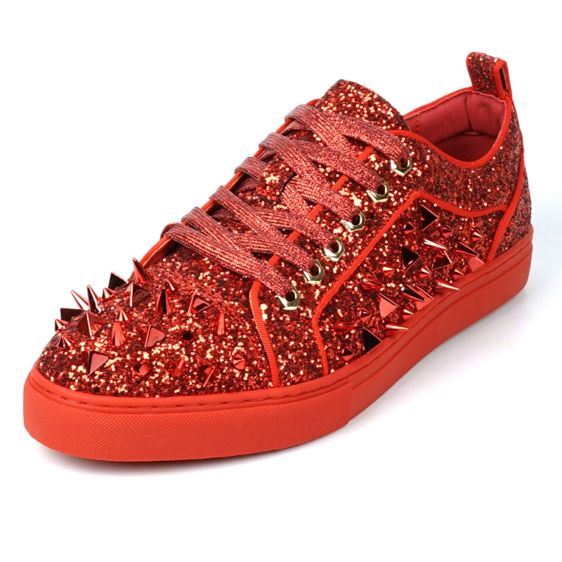 A close-up of the FI-2429 Red Glitter Red Spikes Low Cut Sneaker Encore by Fiesso showcases its dazzling red glitter, bold metal spikes, and matching shoelaces.