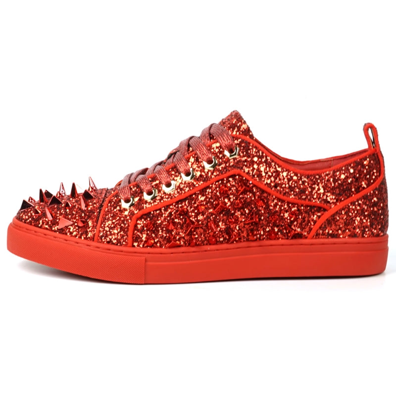 A close-up of the FI-2429 Red Glitter Red Spikes Low Cut Sneaker Encore by Fiesso showcases its dazzling red glitter, bold metal spikes, and matching shoelaces.