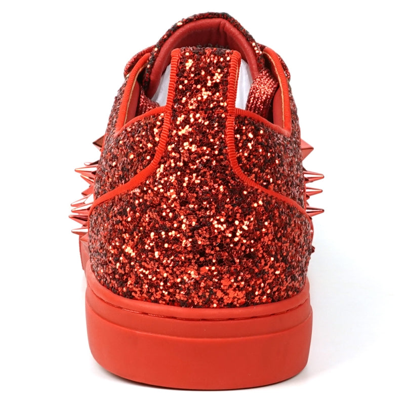 A close-up of the FI-2429 Red Glitter Red Spikes Low Cut Sneaker Encore by Fiesso showcases its dazzling red glitter, bold metal spikes, and matching shoelaces.