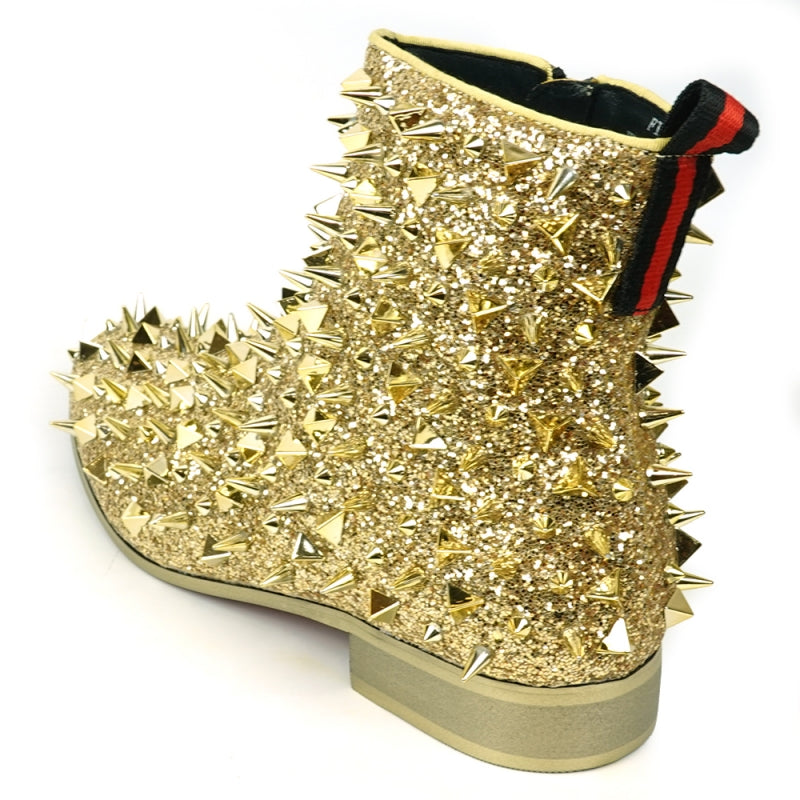 Close-up of the FI-7527 Gold Glitter Gold Spikes Boot Encore by Fiesso, featuring a sparkly gold surface embellished with an array of metallic spikes in different sizes and shapes, capturing the edgy elegance typical of high fashion sneakers against a plain background.