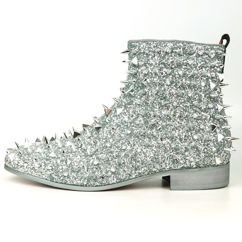 The FI-7527 Silver Glitter Silver Spikes Boot Encore by Fiesso captivates with its sparkling material and metallic spikes. Complemented by a low heel and red pull tab, it echoes the bold style of black glitter boots.