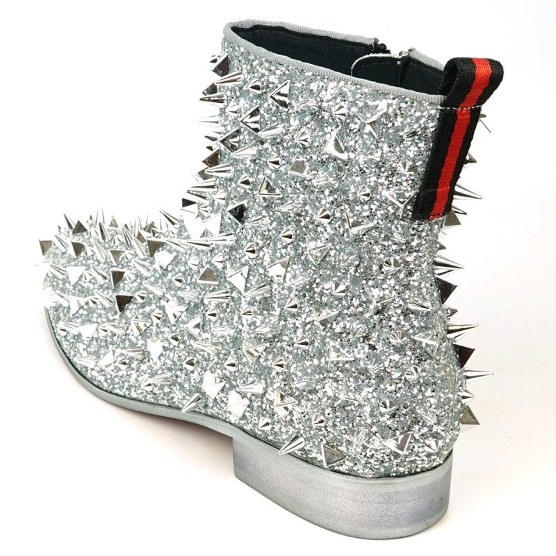 The FI-7527 Silver Glitter Silver Spikes Boot Encore by Fiesso captivates with its sparkling material and metallic spikes. Complemented by a low heel and red pull tab, it echoes the bold style of black glitter boots.