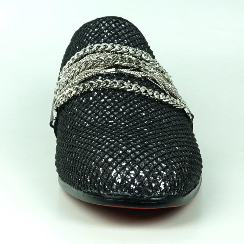 The Fiesso FI-7528 Black Silver Slip-On Loafer is a sophisticated men's dress shoe, featuring a textured leather exterior with a shiny finish. It is elegantly adorned with silver chains across the top and boasts a striking red interior lining, making it the perfect blend of modern style and elegance.