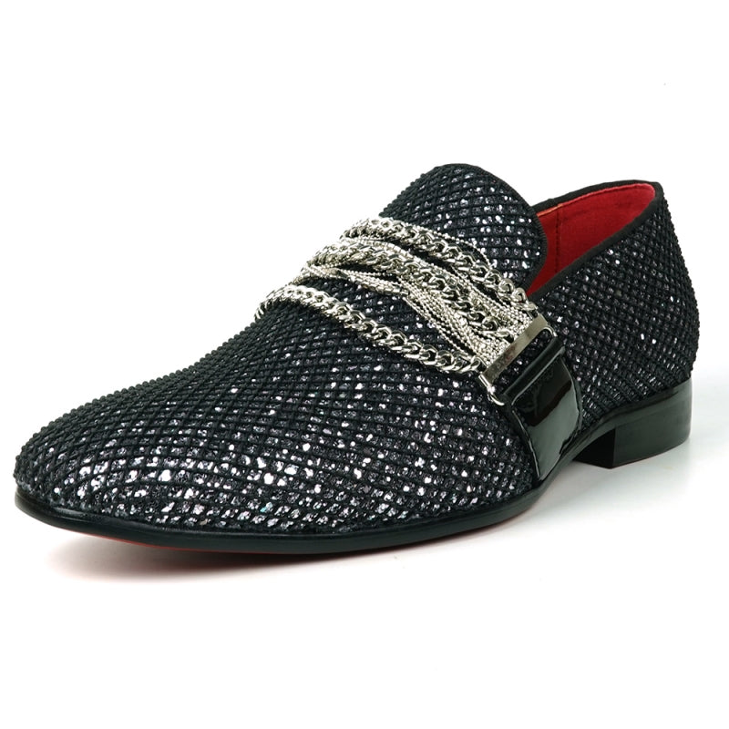 The Fiesso FI-7528 Black Silver Slip-On Loafer is a sophisticated men's dress shoe, featuring a textured leather exterior with a shiny finish. It is elegantly adorned with silver chains across the top and boasts a striking red interior lining, making it the perfect blend of modern style and elegance.