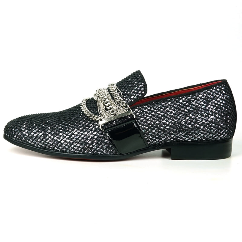 The Fiesso FI-7528 Black Silver Slip-On Loafer is a sophisticated men's dress shoe, featuring a textured leather exterior with a shiny finish. It is elegantly adorned with silver chains across the top and boasts a striking red interior lining, making it the perfect blend of modern style and elegance.