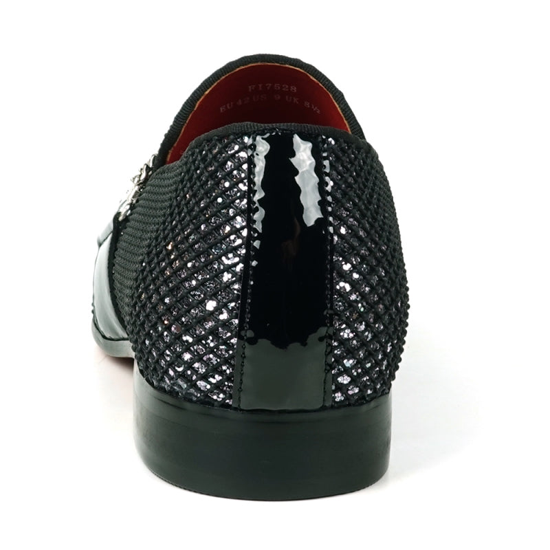 The Fiesso FI-7528 Black Silver Slip-On Loafer is a sophisticated men's dress shoe, featuring a textured leather exterior with a shiny finish. It is elegantly adorned with silver chains across the top and boasts a striking red interior lining, making it the perfect blend of modern style and elegance.