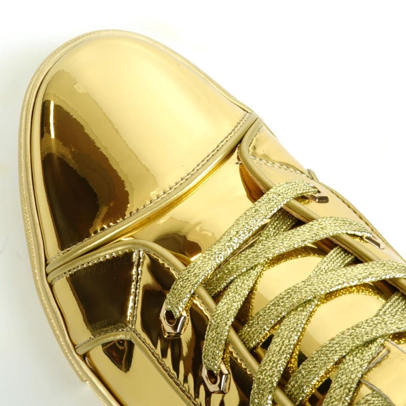 The FI-2416 Gold Patent Leather High Top Sneaker by Fiesso captivates with its lustrous metallic finish and coordinated laces, capturing high fashion in every step.