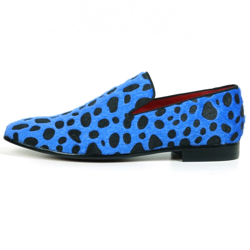 A slip-on loafer featuring a blue and black leopard print design with a pony hair texture, capturing the stylish essence of Fiesso by Aurelio Garcia when admired from the front.