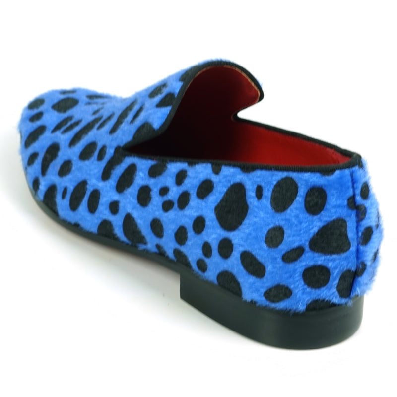 A slip-on loafer featuring a blue and black leopard print design with a pony hair texture, capturing the stylish essence of Fiesso by Aurelio Garcia when admired from the front.