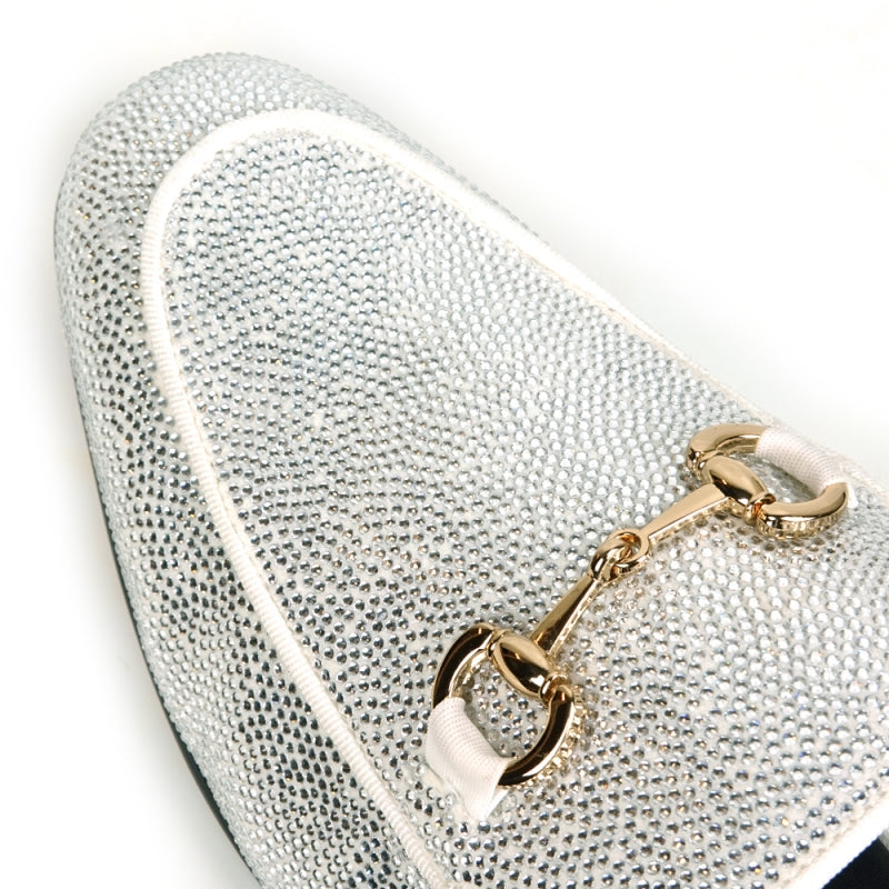 Front view of a Fiesso by Aurelio Garcia sparkling white rhinestone sandal, crafted from suede with a gold ornament detail on the upper.