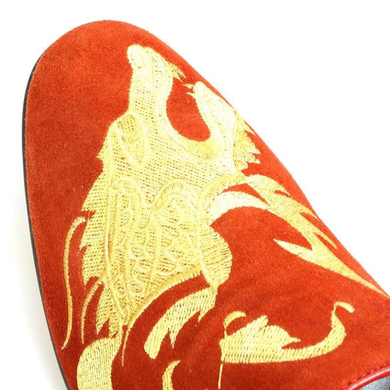 The FI-7039 Red Suede Slip on Loafer by Fiesso features a gold embroidered dragon design and a black sole, viewed from the back. This distinctive piece would effortlessly enhance any collection of men's dress shoes.