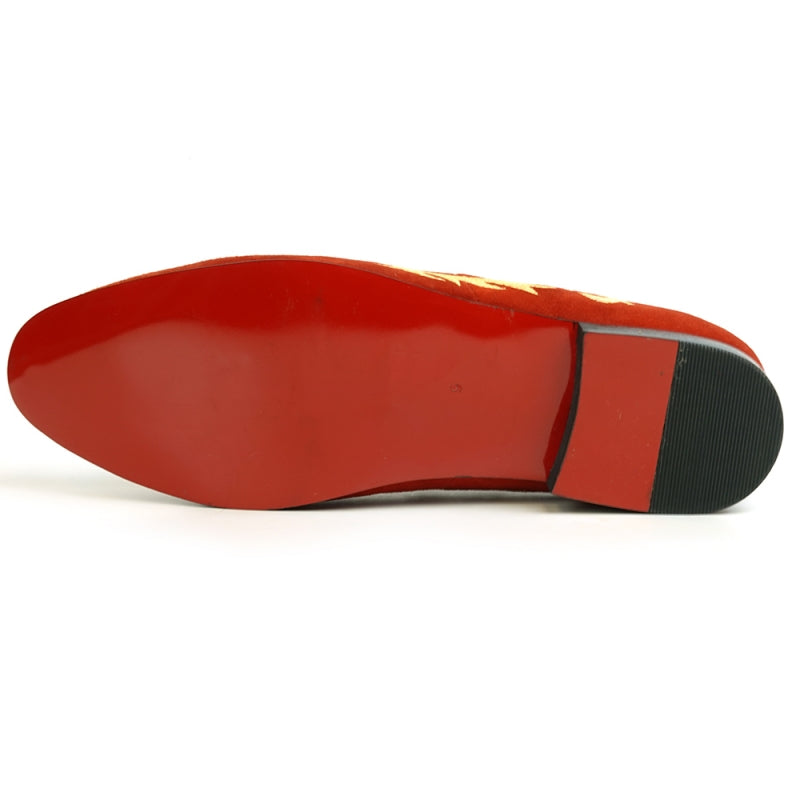 The FI-7039 Red Suede Slip on Loafer by Fiesso features a gold embroidered dragon design and a black sole, viewed from the back. This distinctive piece would effortlessly enhance any collection of men's dress shoes.