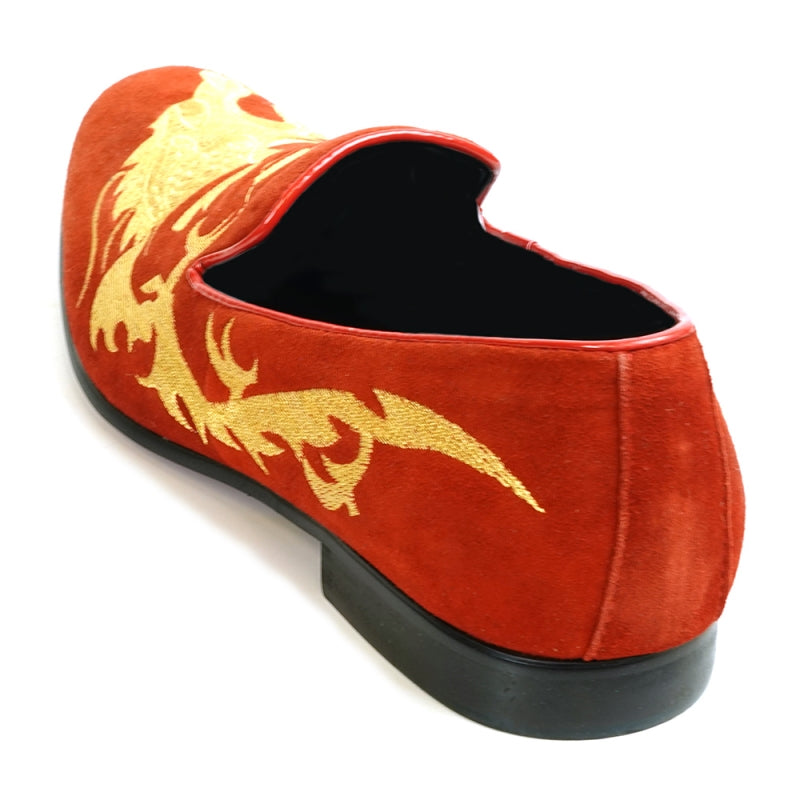 The FI-7039 Red Suede Slip on Loafer by Fiesso features a gold embroidered dragon design and a black sole, viewed from the back. This distinctive piece would effortlessly enhance any collection of men's dress shoes.