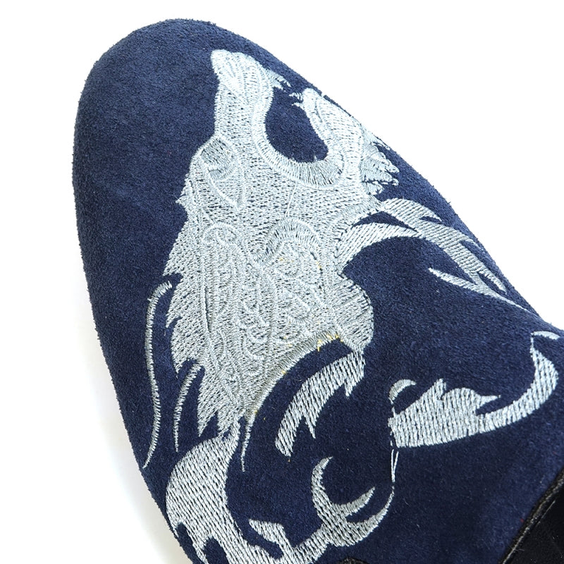 A stylish FI-7039 Navy Suede Slip-on Loafer by Fiesso, showcasing elegant silver embroidery and a black sole, viewed from the side.