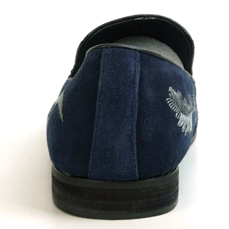 A stylish FI-7039 Navy Suede Slip-on Loafer by Fiesso, showcasing elegant silver embroidery and a black sole, viewed from the side.