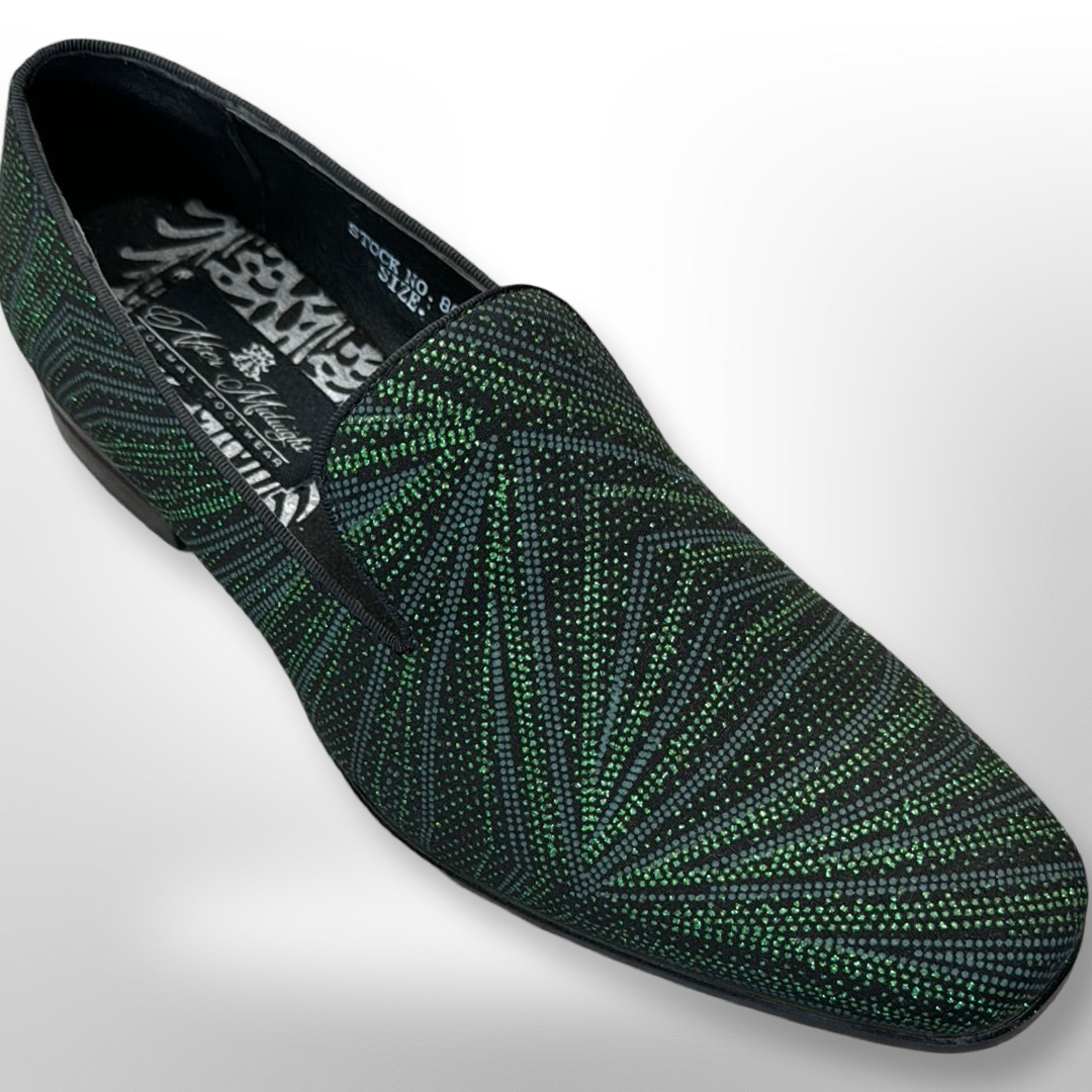 Fiesso's Shoe 65 in size 8 features a black slip-on design with a geometric green dotted pattern, a slightly raised heel, and a patterned interior. Please be aware that this is a FINAL SALE item with NO EXCHANGES or RETURNS.