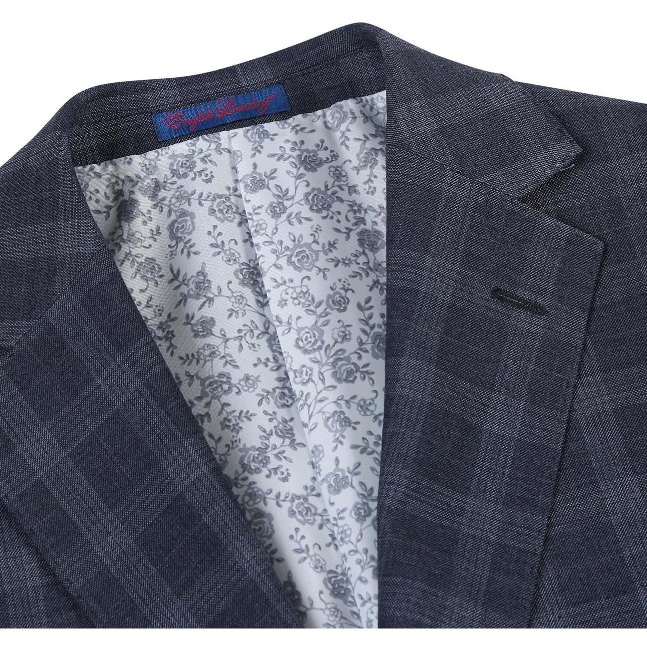 Displayed on a mannequin is the ENGLISH LAUNDRY Iron Gray Check Suit 92-52-410EL from English Laundry, featuring a slim fit jacket paired with matching pants, complemented by a white dress shirt and a patterned tie.