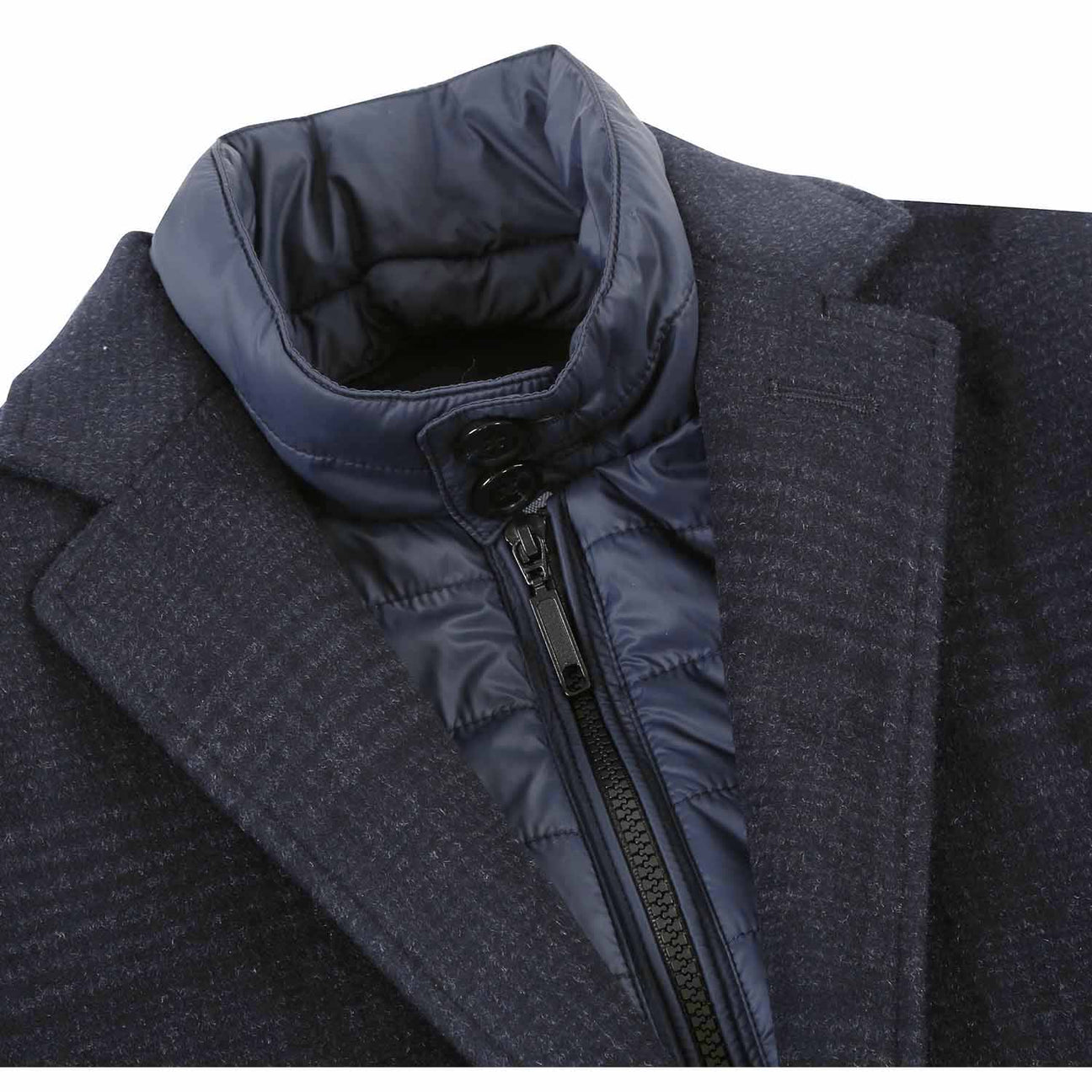 The ALESSANDRO VITELLO Blue Long Coat 830-3 from Alessandro Vitello showcases a classic single-breasted design with a three-button closure against a white background. Crafted from fine wool in a dark plaid pattern, it features a sophisticated notch lapel and includes a zip-up inner layer visible at the collar.