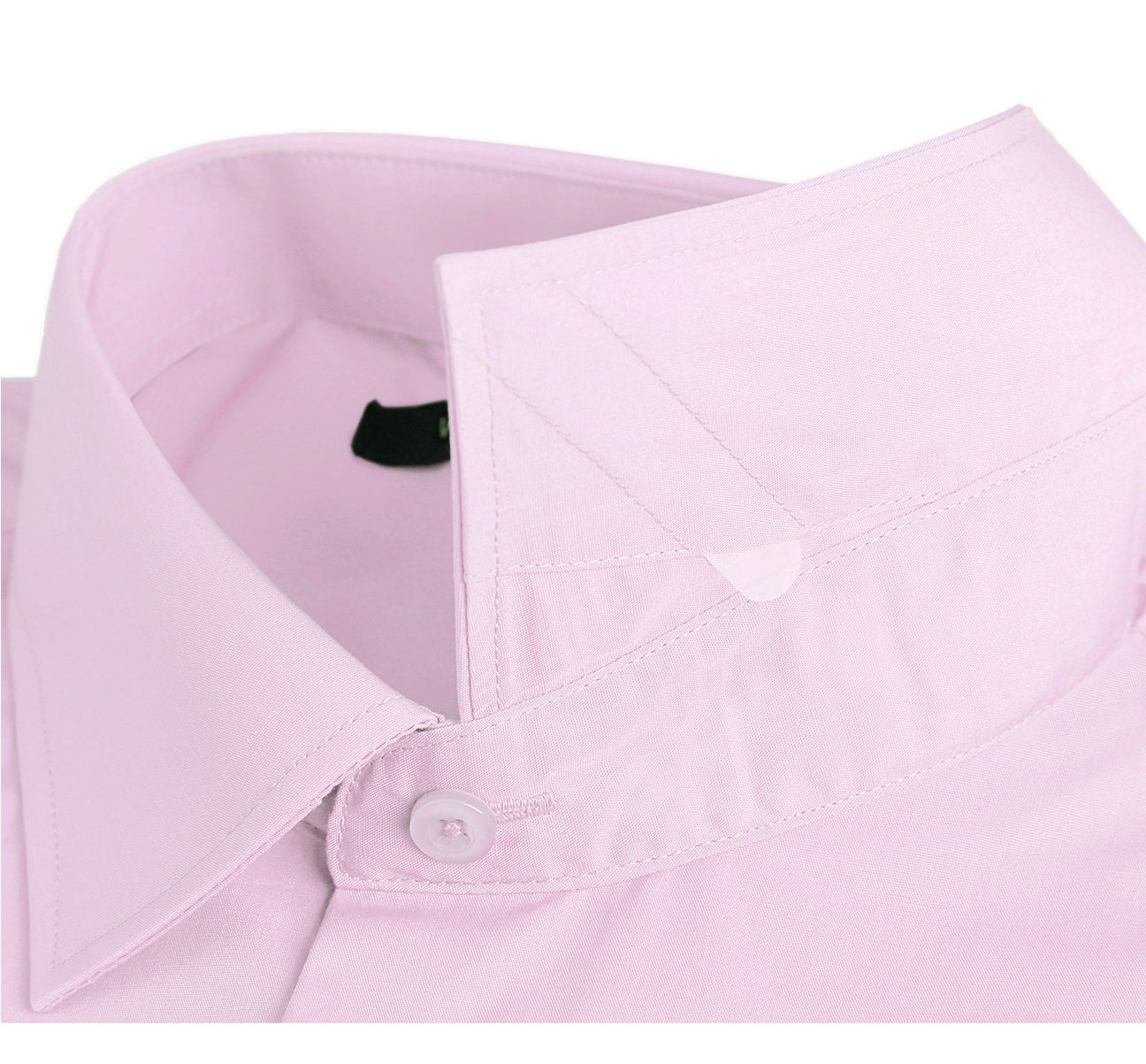 The folded VERNO Light Pink Classic Fit Long Sleeve Travel Easy-Care Cotton Dress Shirt by Renoir features a pointed collar and buttoned cuffs. Made from 100% cotton, the fabric close-up reveals its smooth, fine texture that is also wrinkle-resistant.