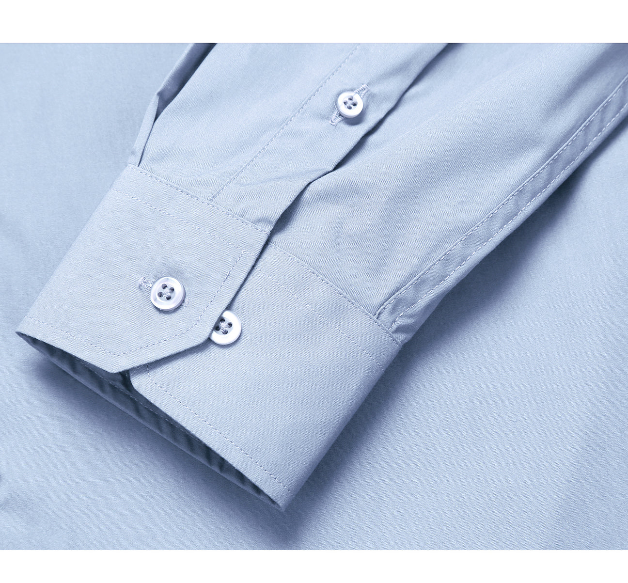 The VERNO Light Blue Classic Fit Long Sleeve Travel Easy-Care Cotton Dress Shirt CS0221 by Renoir features a folded design in light blue with a classic fit, showcasing its spread collar and buttoned cuffs. A close-up highlights the wrinkle-resistant texture of the 100% cotton fabric.