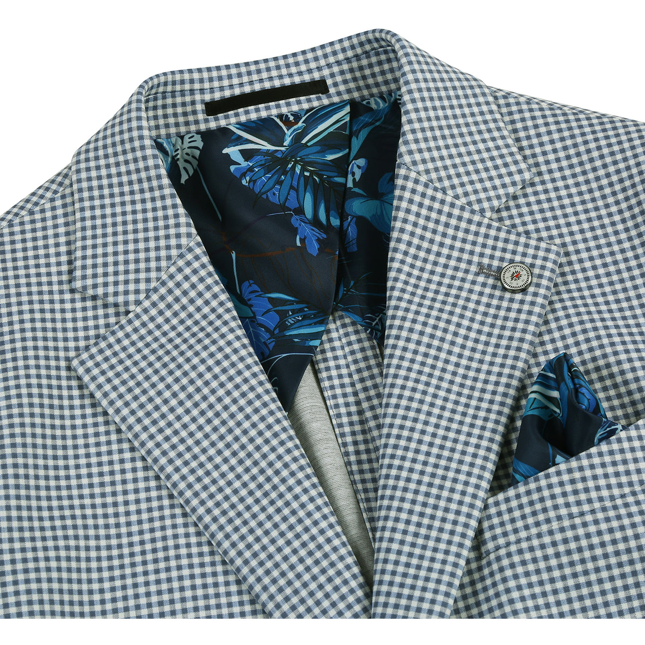 Pellagio Blue White Men's Half Canvas Blazer PS24-9 with a blue tie and pocket square. Features a light gray checkered pattern, polyester and spandex fabric composition, close-up views of the lining and buttons, as well as intricate design details.