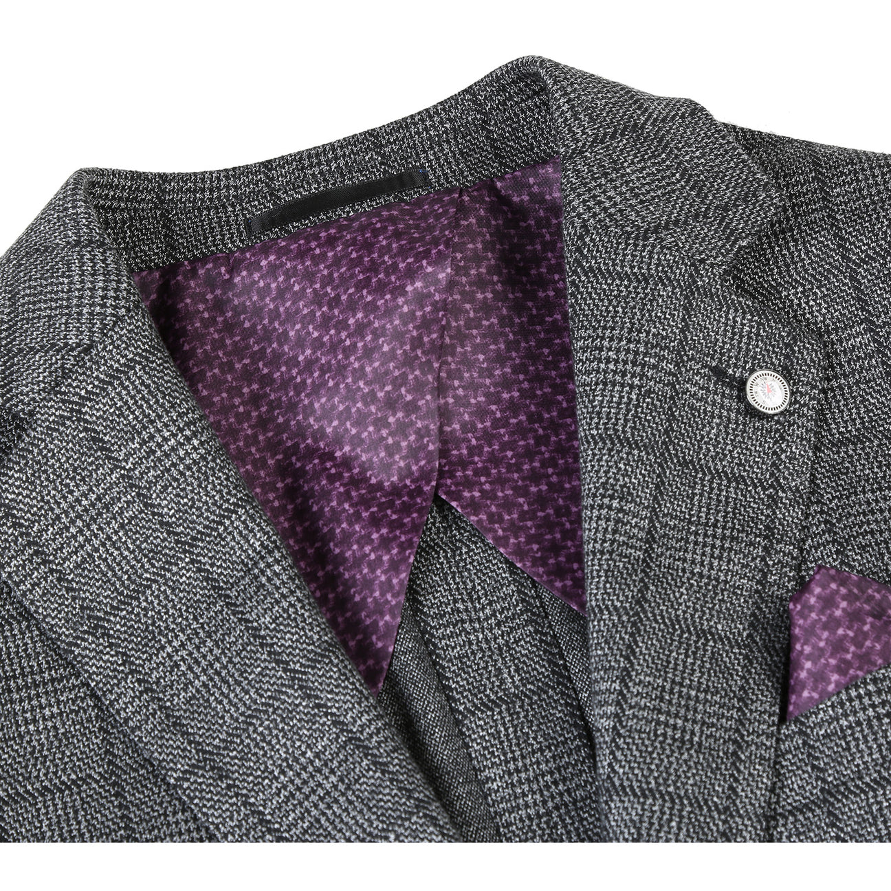 The Pellagio Men's Half Canvas Gray Blazer PF23-4, showcased on a mannequin, is complemented by a white shirt, a purple polka dot tie, and a matching pocket square. This slim fit, single-breasted ensemble from Pellagio captures modern elegance while preserving a timeless charm.