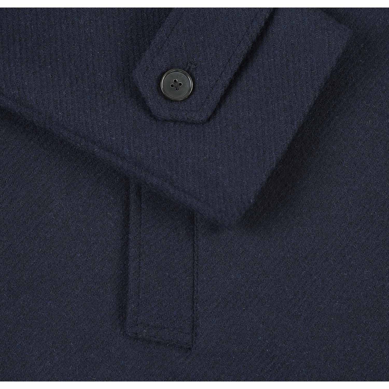 The ENGLISH LAUNDRY Navy Long Coat EL84-10-410 by English Laundry is a dark blue, single-breasted overcoat featuring a notch lapel collar and three black buttons, with a sleek longline design set against a plain white background.