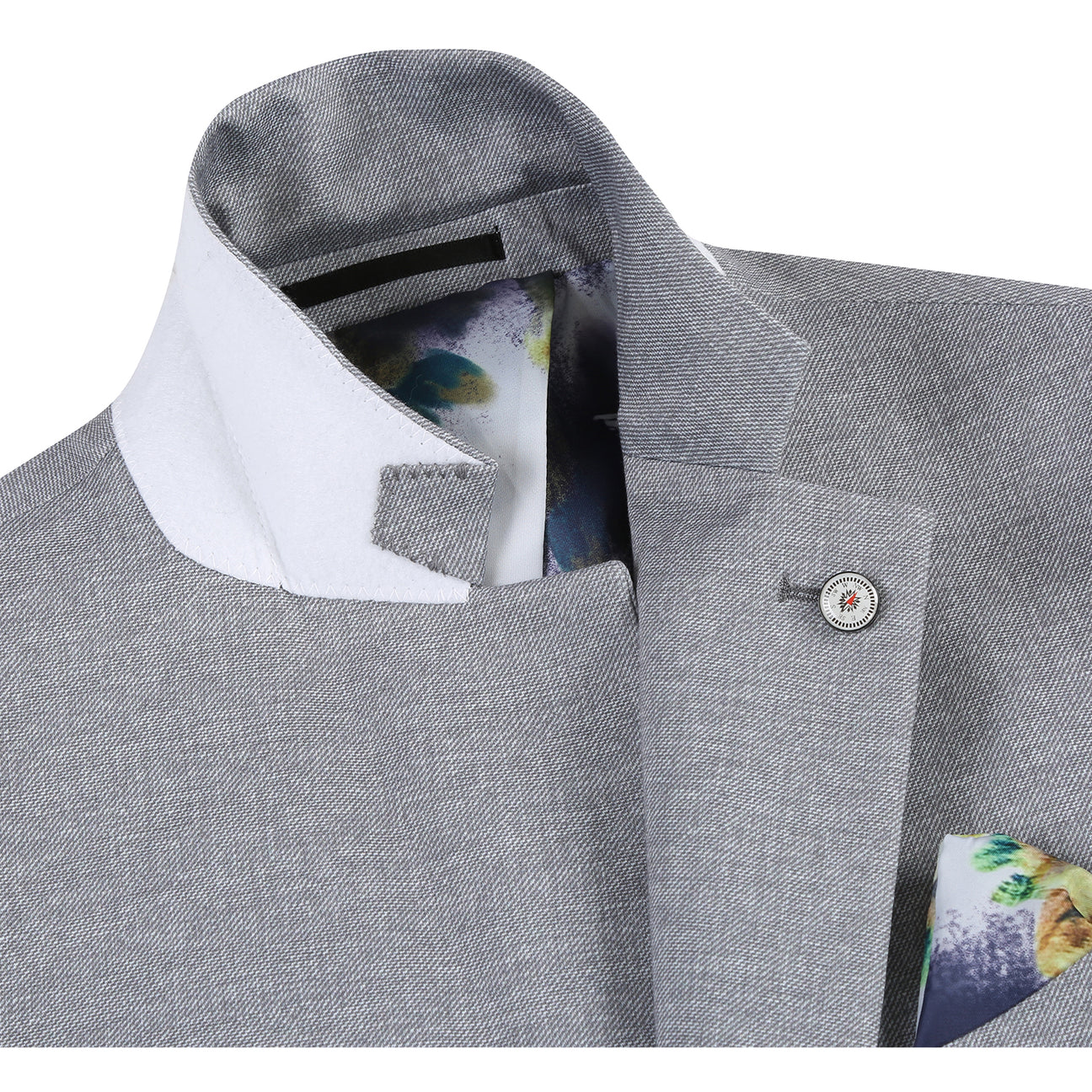 The Pellagio Riserva JKT Sports Coat PS24-2 is a gray blazer by Pellagio, featuring tropical print lining, button details, and a fabric swatch. It is crafted from a blend of 86% polyester, 9% rayon, and 5% spandex for both comfort and style.