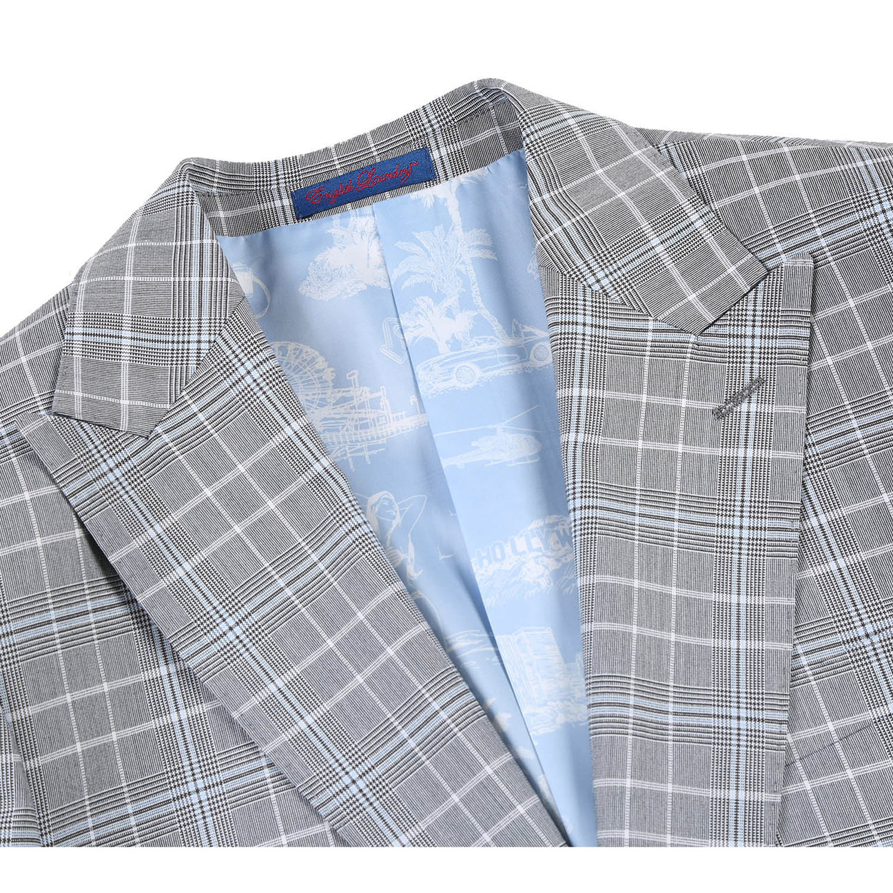 The mannequin displays the ENGLISH LAUNDRY White Smoke Plaid Suit 82-60-092EL from English Laundry, featuring a slim fit with a stylish grey plaid pattern over a crisp white dress shirt, accented by a dark purple polka dot tie and distinguished peak lapels.