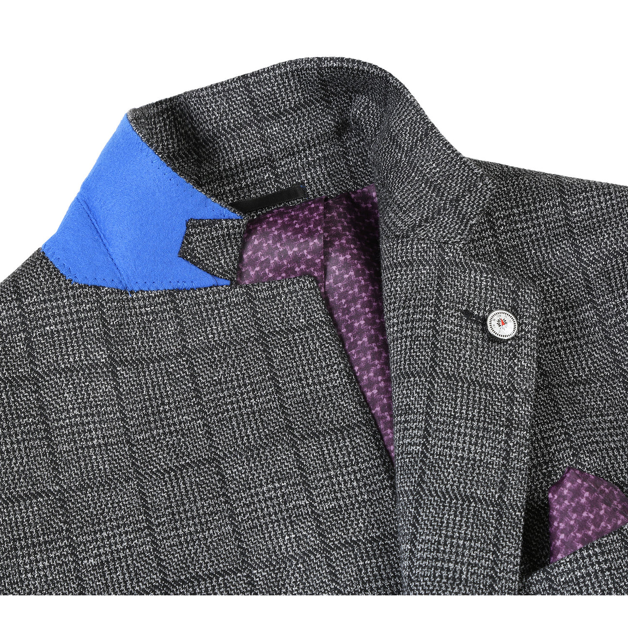 The Pellagio Men's Half Canvas Gray Blazer PF23-4, showcased on a mannequin, is complemented by a white shirt, a purple polka dot tie, and a matching pocket square. This slim fit, single-breasted ensemble from Pellagio captures modern elegance while preserving a timeless charm.