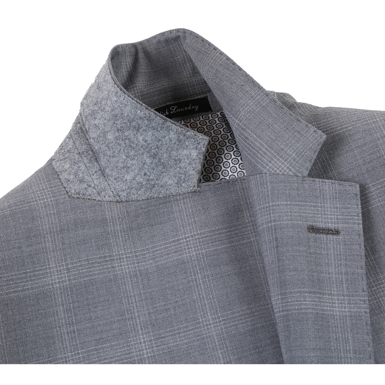 The ENGLISH LAUNDRY Light Gray Window Pane Check Wool Suit, model EL72-62-092 by English Laundry, is displayed on a mannequin with peak lapels, accompanied by a sharp white shirt and a vibrant orange patterned tie.