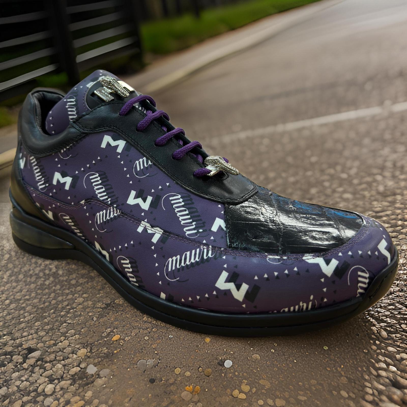 The Mauri 8900 Purple/Black Shoes feature a custom design with "MAUI" and "M" patterns, silver accents, and black duct tape over the toe area, all elegantly displayed on a textured surface.