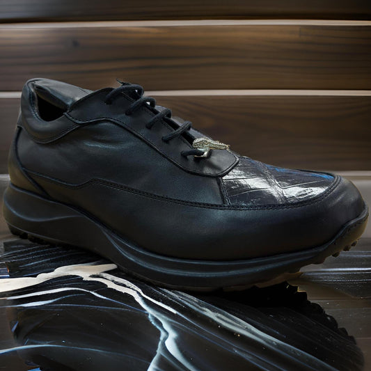 A pair of Mauri 8900 Black Shoes, featuring a crocodile-textured leather design with glossy toe overlays and sleek black laces, is elegantly displayed on a reflective marble surface against a backdrop of rich wooden paneling.