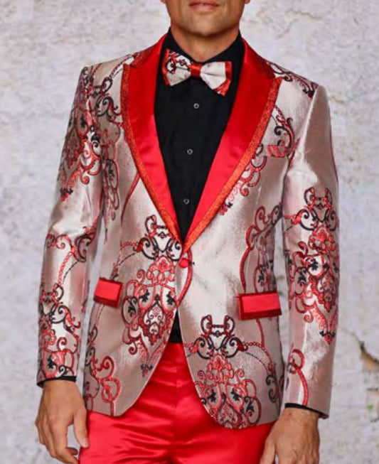 A man dressed in the INSOMNIA MZS-538 RED Blazer by Inserch, featuring a shiny pattern with red trim and a matching bow tie, stands against a textured background.