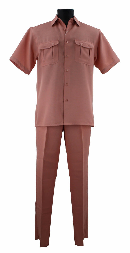 The Bassiri mannequin displays the Bassiri Peach 2pc Set A 138, a stylish ensemble crafted from soft polyester. This chic outfit includes a dusty pink short-sleeve button-up shirt and matching pants, perfectly blending comfort with fashion.