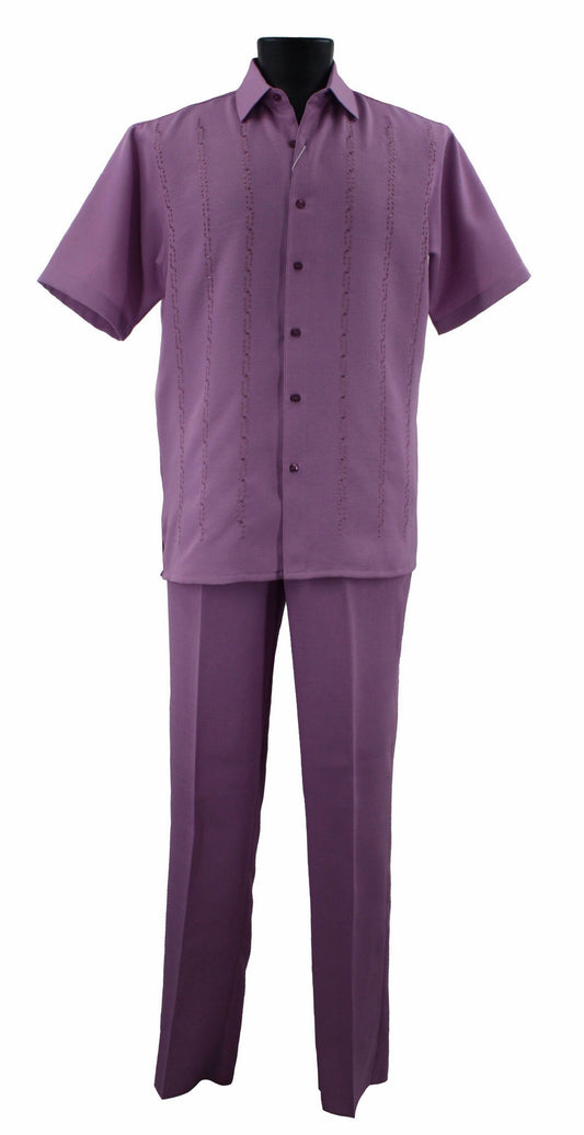 Displayed elegantly on a mannequin is the Bassiri Lilac 2pc Set A 139, featuring a short-sleeved button-up shirt and matching pants, all crafted from polyester. This ensemble by Bassiri exudes sophistication and modernity.